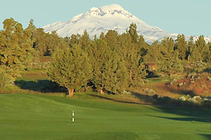 Green and pin with Mount Bachelor in the background.