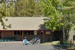 Sunriver Resort Bike Barn storefront with row of parked bicycles