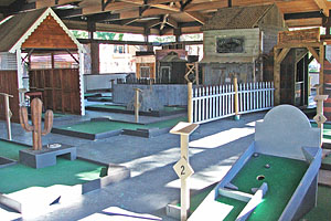 Mining town themed miniature golf course in pavillion.