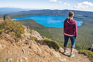 Hiker overlooking the Newberry caldera and Paulina Lake.